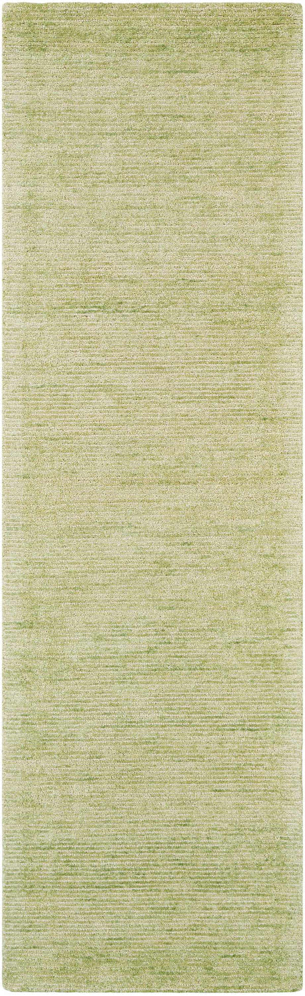 Close-up of the Nourison Weston Citron Rug. Modern design with a subtle, textured pattern in shades of light green.