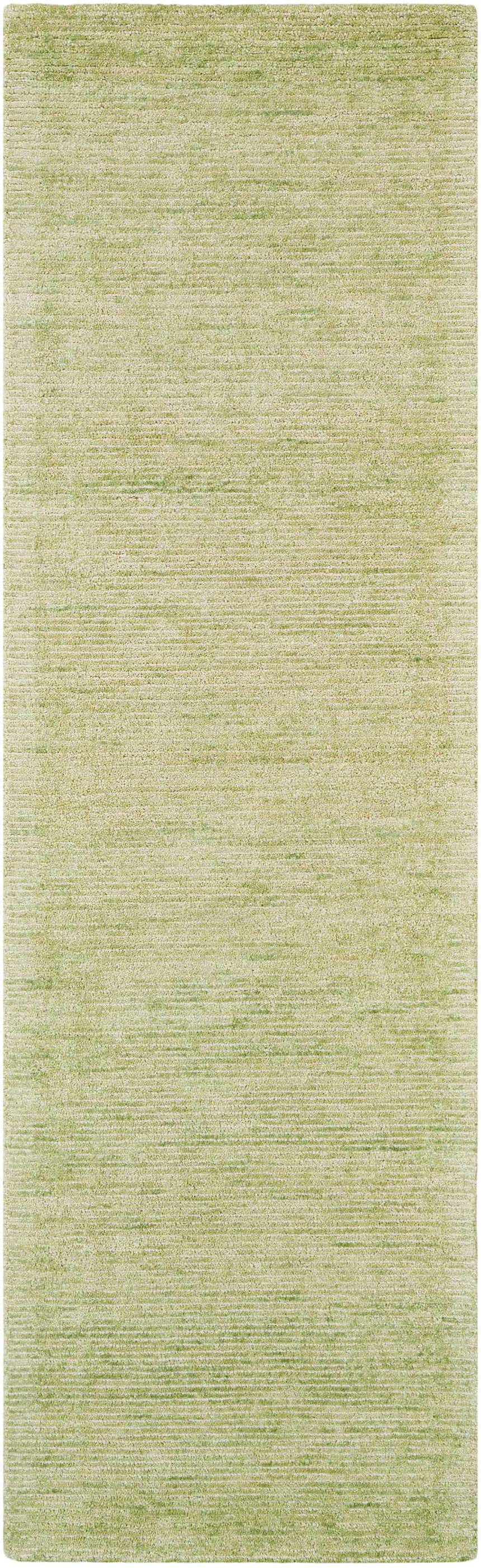 Close-up of the Nourison Weston Citron Rug. Modern design with a subtle, textured pattern in shades of light green.