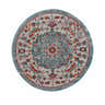 Close-up of round Tigril Blue 2303 area rug. Beige, ivory, and turquoise floral bohemian pattern. Design-Round