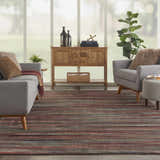 Living room with gray sofa and Nourison Expressions Multicolor Painterly Area Rug.