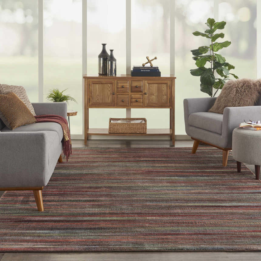Living room with gray sofa and Nourison Expressions Multicolor Painterly Area Rug.