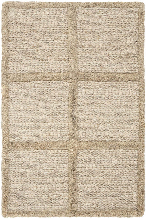 Close-up of the textured DKNY Pure Framework Camel rug. Handmade wool rug with a grid pattern in neutral camel tones.