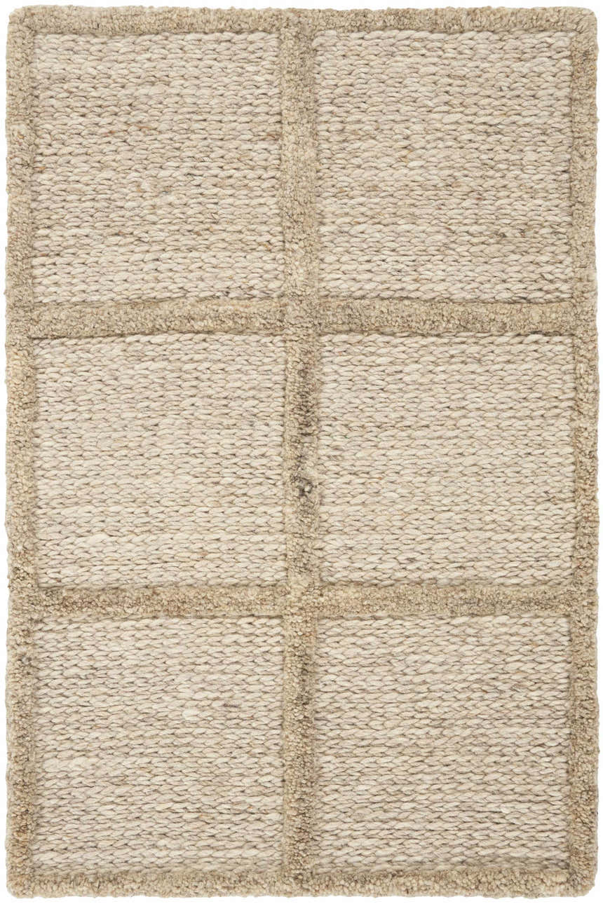 Close-up of the textured DKNY Pure Framework Camel rug. Handmade wool rug with a grid pattern in neutral camel tones.