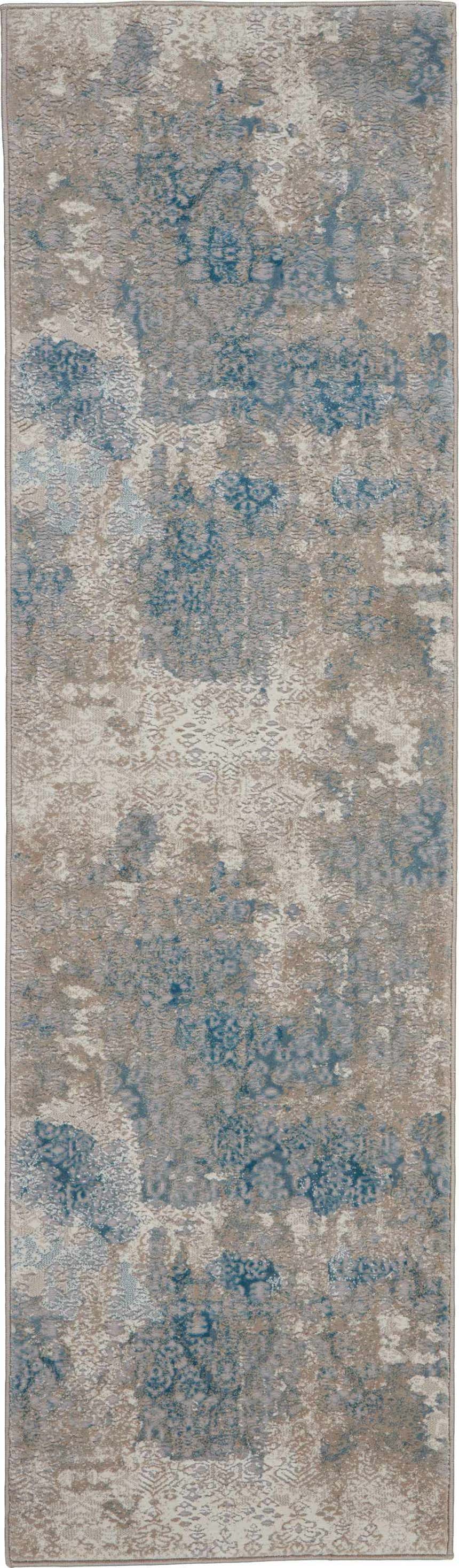 Close-up of Nourison Karma Ivory/Light Blue rug with vintage chestnut pattern and soft texture. Clearance.