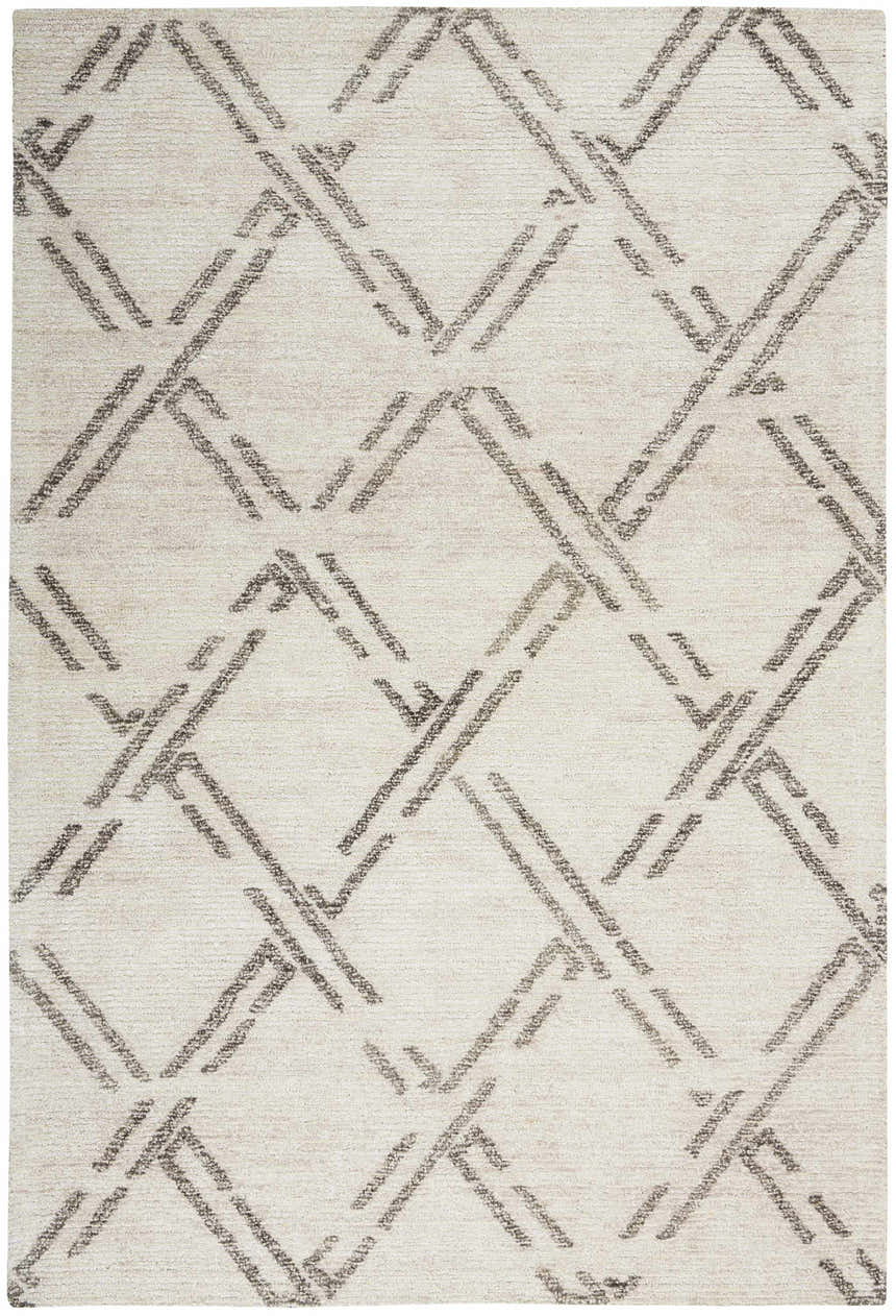Close-up of Nourison Venosa Ivory/Grey rug. Mid-century modern style with a geometric diamond pattern. Handmade texture.
