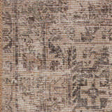 Close-up of the Four Hands Priya Area Rug. Machine woven rug in camel, light beige, and tan with a traditional pattern. Texture