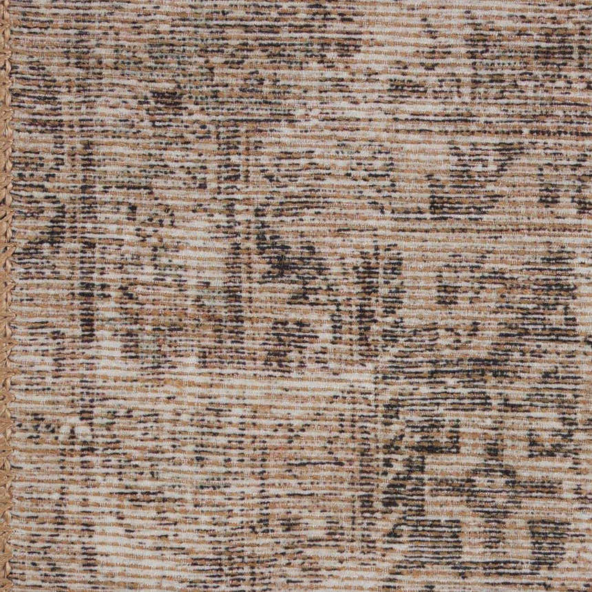 Close-up of the Four Hands Priya Area Rug. Machine woven rug in camel, light beige, and tan with a traditional pattern. Texture