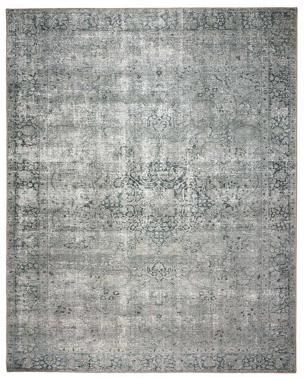 Close-up of the Four Hands Morelli Blue Area Rug featuring a traditional vintage design and distressed texture. Design-Rectangle