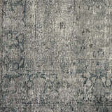 Close-up of the Four Hands Morelli Blue Area Rug. Machine woven rug with a traditional vintage pattern and farmhouse style. Texture