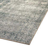 Close-up of the Four Hands Morelli Blue Area Rug, showcasing its traditional vintage pattern and woven texture. Corner