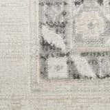 Close-up of the high pile Nourison Serenity Home Ivory Grey rug with a vintage-inspired pattern and texture.
