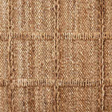 Close-up of the Four Hands Grid Jute Rug, showing the natural jute texture and grid pattern. Hand woven rug. Texture