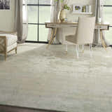 Bright home office with Nourison Twilight Ivory Green rug, desk, chair, and natural light.
