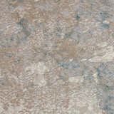 Close-up of the Nourison Karma Ivory/Light Blue Vintage rug showing texture and chestnut, ivory, and blue colors.