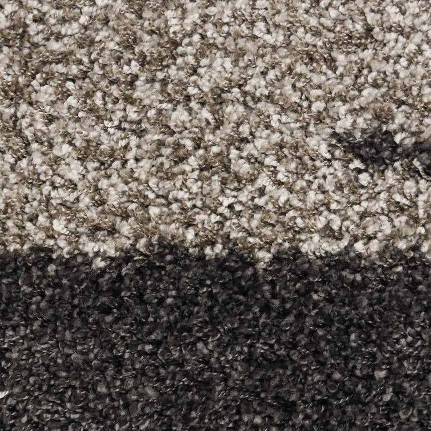 Close-up of the Nourison Amore Marble Shag rug showing its plush texture and marble-like pattern in shades of gray and white.