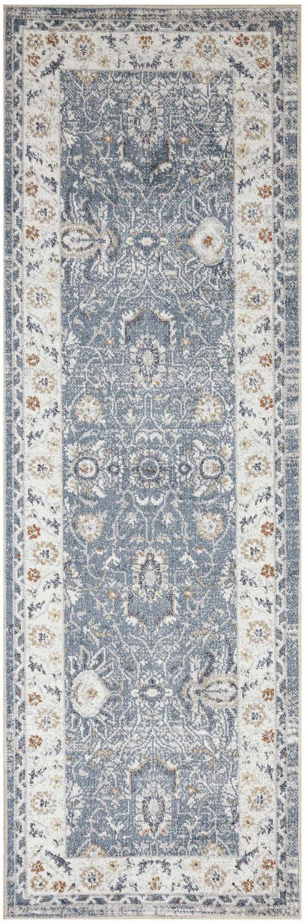 Close-up of the Nourison Astra Machine Blue Vintage Area Rug. Features a distressed, ornate pattern and light blue color.