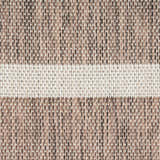 Close-up of the woven texture of the Nourison Positano Natural Ivory rug, featuring chestnut brown and ivory tones.