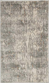 Close-up of a Nourison Quarry Beige Gray rug. Features a distressed, abstract pattern with beige, gray, and brown hues.