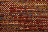 Close-up of Feizy Deja Modern Solid rug. Brown, red, and tan hues with a casual, contemporary design. Texture