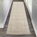 Hallway scene with a Nourison Palermo Beige runner rug on dark wood floors.