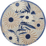 Close-up of the round Nourison Aloha Blue Grey Outdoor Area Rug with a floral daisy pattern and blue border.