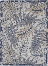Close-up of the Nourison Aloha Ivory Navy Tropical Area Rug featuring a leaf pattern in chestnut, ivory, and navy.