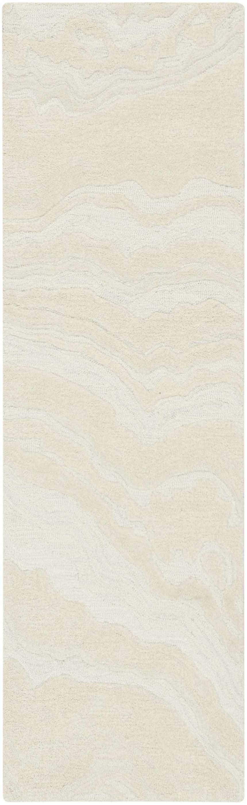 Close-up of the Nourison Graceful Ivory rug. Chestnut wool rug with a subtle, abstract wave pattern and textured handmade weave.