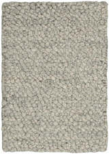 Close-up of the Calvin Klein Riverstone rug. Grey and ivory wool with a textured, pebble-like design. Handmade.