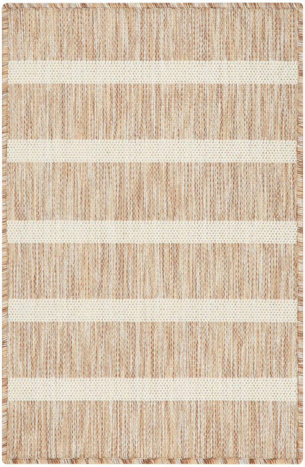 Close-up of the Nourison Positano Beige Ivory rug, showing chestnut brown stripes on ivory, and textured weave.