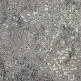 Close-up of the grey Michael Amini MA90 Uptown rug. Modern design with white and dark grey accents. Abstract pattern.