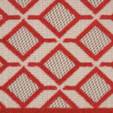 Close-up of the Nourison Aloha Red Casual Area Rug, featuring a geometric diamond pattern.