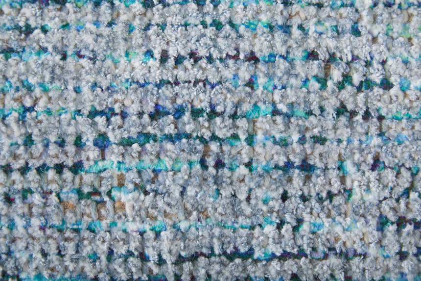Close-up of the hand woven Feizy Caldwell Rug in blue and gray. Distressed transitional design with wool and viscose texture. Texture
