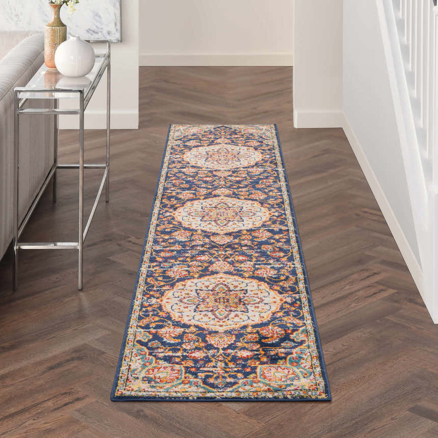 Hallway with Nourison Passion Navy Multicolor runner rug, wood floors, console table.