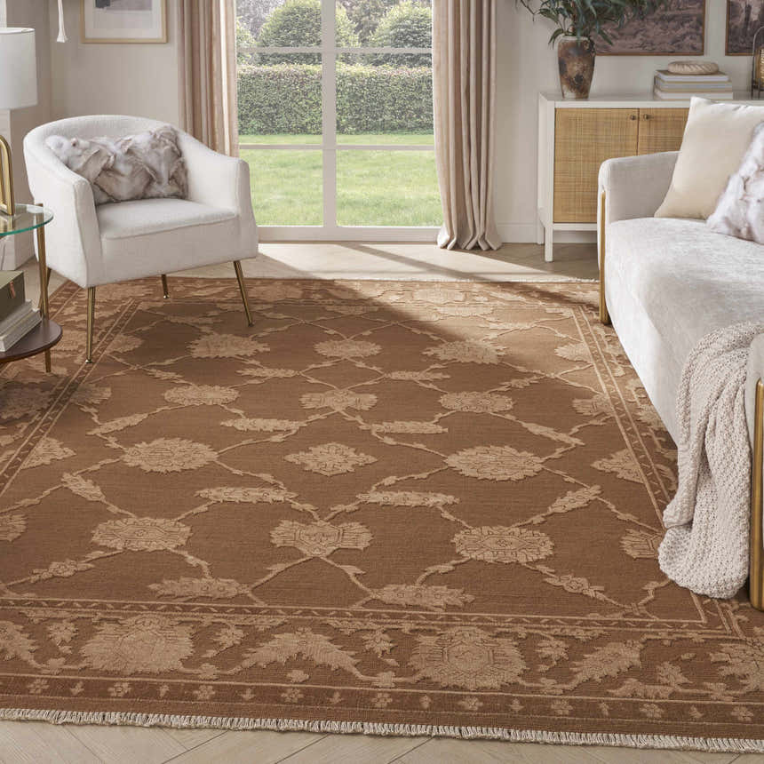 Living room with white furniture and Nourison Silk Pointe Brown Vintage Area Rug.