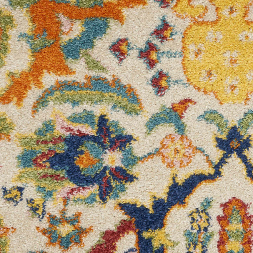 Close-up of Nourison Allur Ivory Multicolor Bohemian rug showing floral pattern and texture. Chestnut, blue, yellow and red colors.