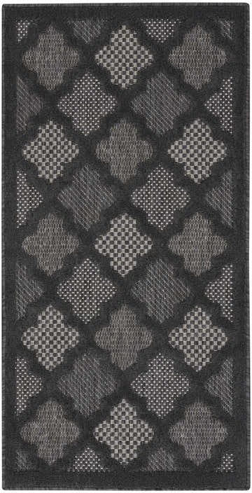 Close-up of the Nourison Easy Care Charcoal Black Modern Area Rug featuring a taupe geometric diamond pattern.