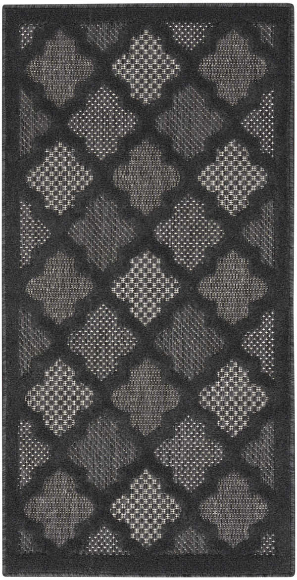 Close-up of the Nourison Easy Care Charcoal Black Modern Area Rug featuring a taupe geometric diamond pattern.