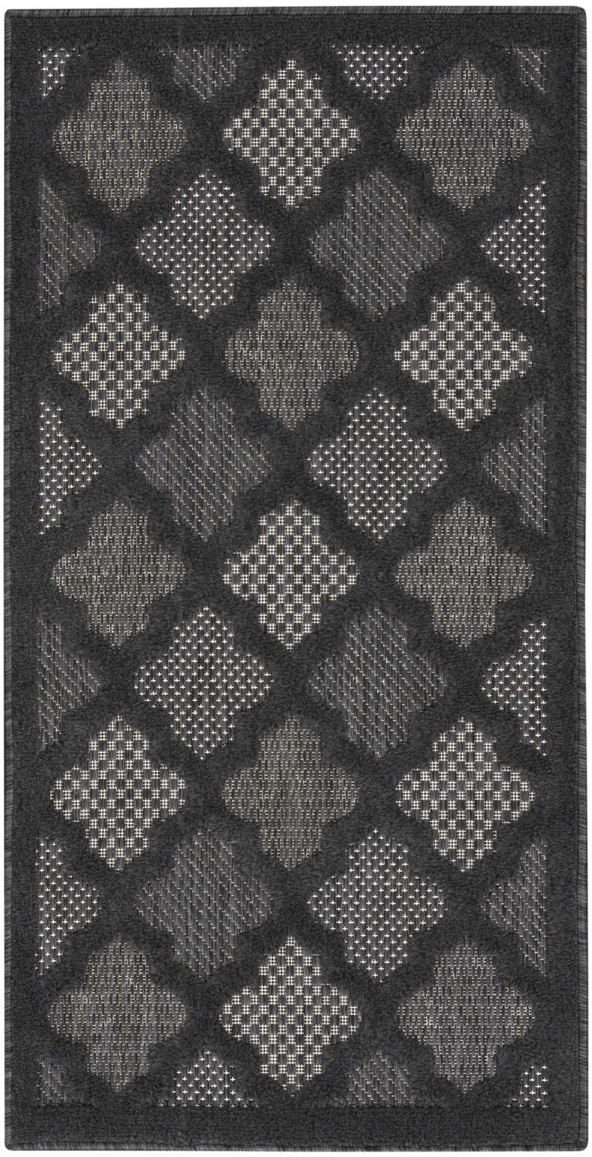 Close-up of the Nourison Easy Care Charcoal Black Modern Area Rug featuring a taupe geometric diamond pattern.
