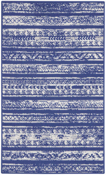 Close-up of Nourison Whimsicle Navy Ivory Bohemian rug featuring a horizontal stripe pattern and tribal-inspired designs.
