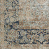 Close-up of the Nourison Malta Cloud Vintage Area Rug showing its cloud, tan, and blue vintage pattern and soft texture.