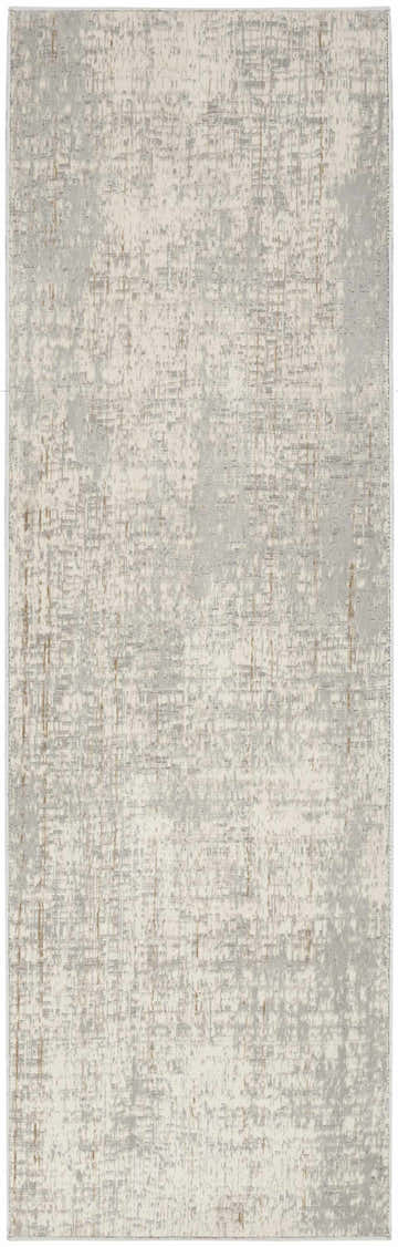 Close-up of the Calvin Klein CK950 Rush Grey rug. High pile, machine-made with a modern, abstract design in gray and ivory.
