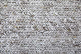 Close-up of the hand-knotted texture of the Feizy Finley Modern Solid silver gray area rug. Texture