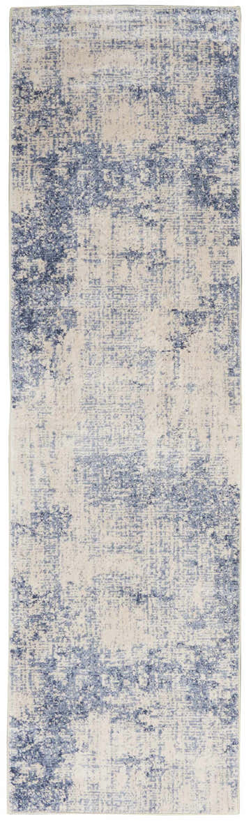 Close-up of Nourison Silky Textures Ivory/Blue rug. Modern area rug with chestnut accents and subtle mid-century pattern.