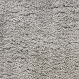 Close-up of the plush Nourison Dreamy Shag Silver Gray rug, showing its soft, textured shag pile.