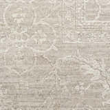 Close-up of the Nourison Moonlit Ivory Grey Vintage Area Rug, showing the pile texture and chestnut-colored vintage pattern.