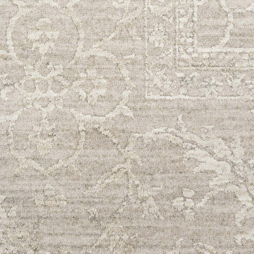 Close-up of the Nourison Moonlit Ivory Grey Vintage Area Rug, showing the pile texture and chestnut-colored vintage pattern.