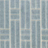 Close-up of Nourison Charm Blue Ivory rug. Modern geometric design with vertical and horizontal lines. Soft texture.