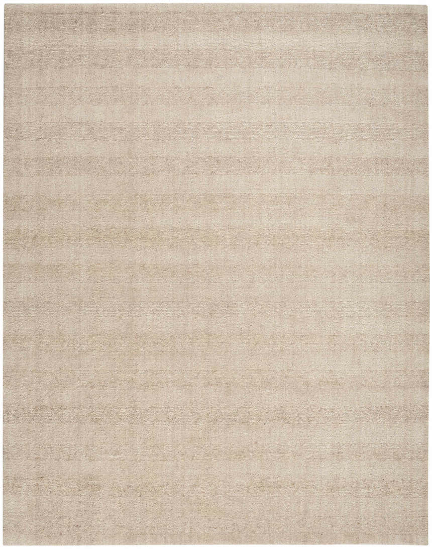 Close-up of the beige Calvin Klein CK043 Spun rug. Handmade New Zealand wool with subtle horizontal striations.