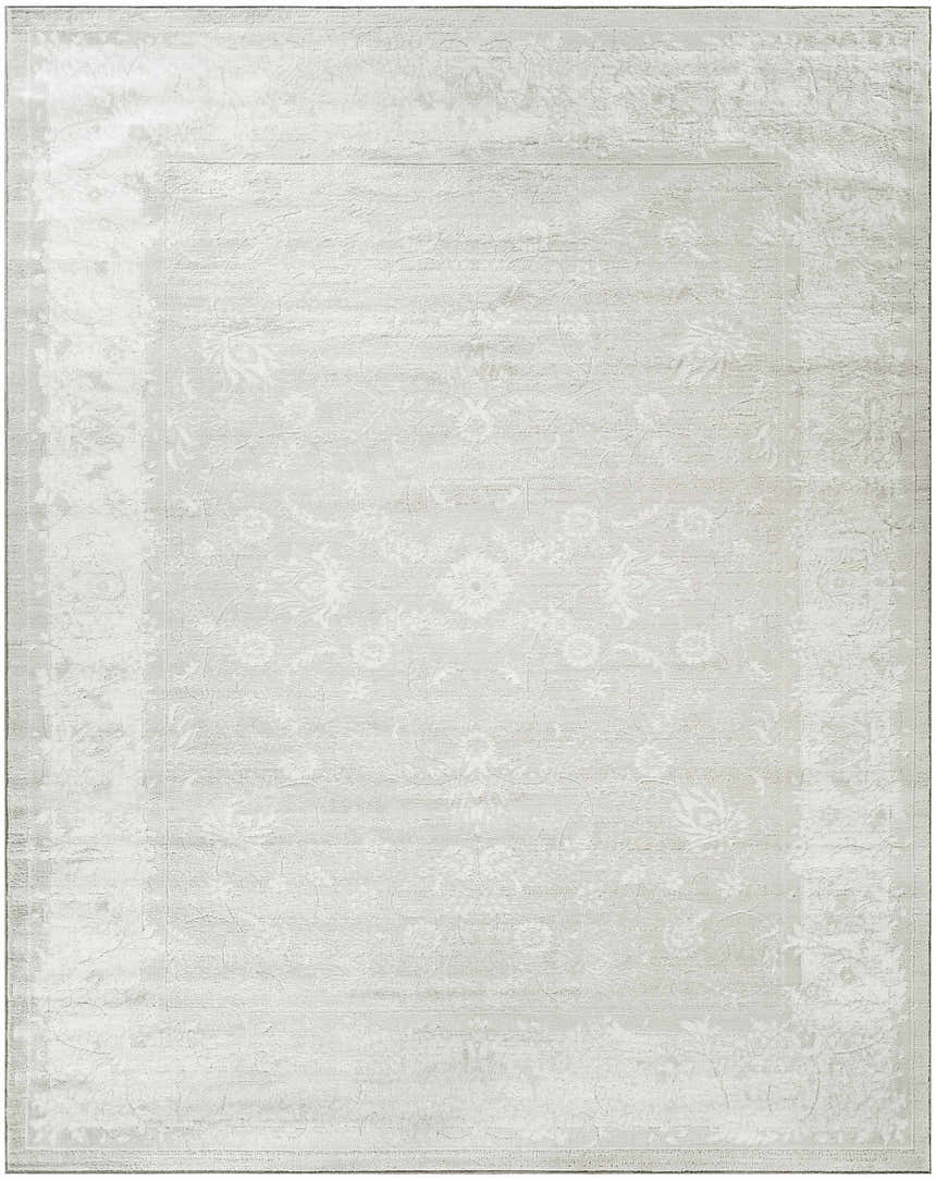 Close-up of the light gray Nourison Dekor vintage rug, featuring a subtle floral pattern and high pile texture.