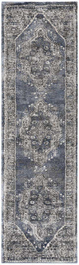Close-up of the Nourison American Manor Blue Farmhouse Indoor Area Rug featuring a distressed, light blue pattern.